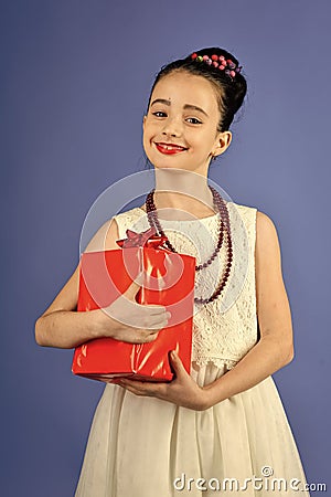 Boxing day, holiday celebration and party. Small girl with shopping package, black friday. Childhood and happiness, gift Stock Photo