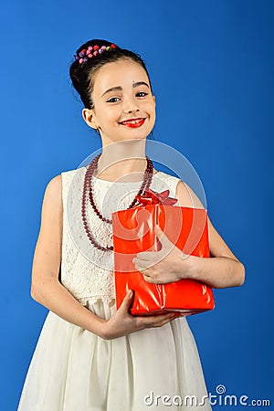 Boxing day, holiday celebration and party. Small girl with shopping package, black friday. Childhood and happiness, gift Stock Photo