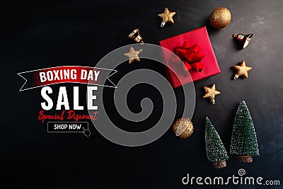 Boxing day sale with Christmas present and xmas decoration on black background Stock Photo