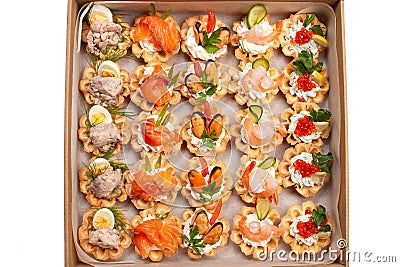 Boxing with food, cardboard box with snacks, home delivery. Catering. Gift for any holiday. Ready family dinner, party food Stock Photo