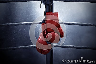 Boxing gloves hanging on the ring Stock Photo