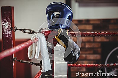 Boxing gloves, headgear and a towel kept on boxing ring Stock Photo