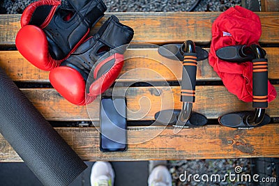 Boxing Gloves And Sport Equipment on the bench, Nobody Stock Photo