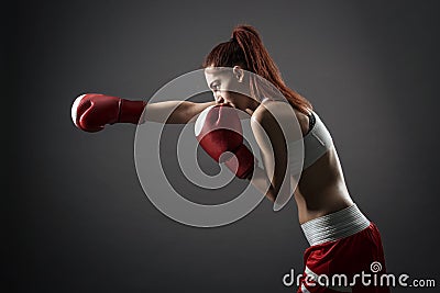 Boxing woman during exercise Stock Photo