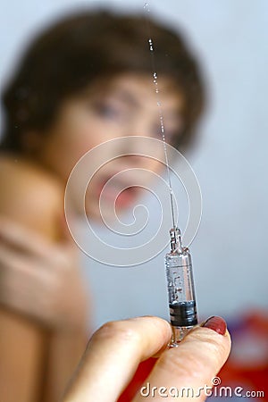 Boy afraid of vaccination syringe Stock Photo