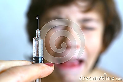 Boy aftaid of vaccination injection Stock Photo