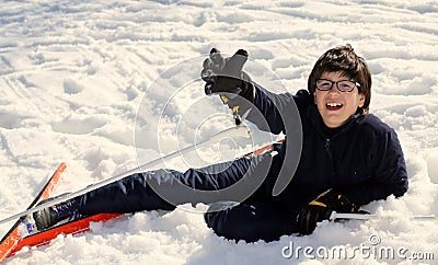 Boy asks for help after the fall on skis Stock Photo