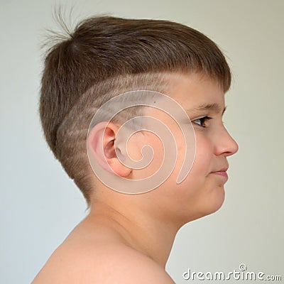 Boy with asymmetrical haircut Stock Photo