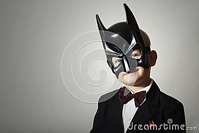 Boy in Batman Mask. Funny Child in Black Suit Stock Photo