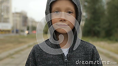 A Boy in a Black Hood on the Street Stock Footage - Video of child ...