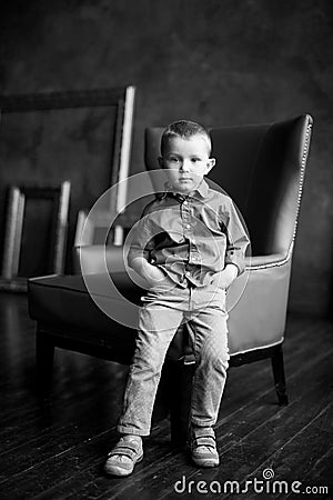 The boy in the blue shirt and corduroy pants Stock Photo