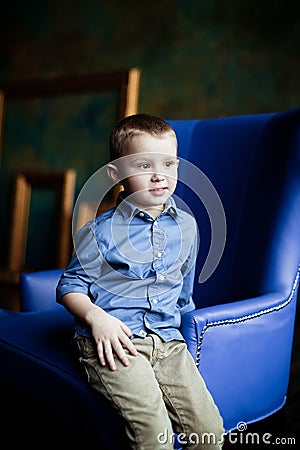 The boy in the blue shirt and corduroy pants Stock Photo