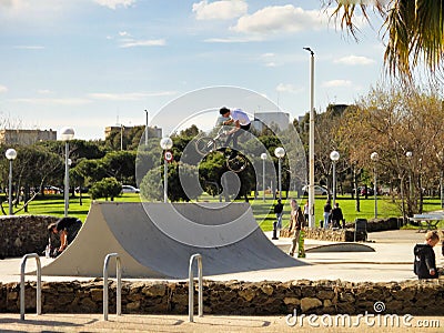 Boy on a bmx/mountain bike jumping in Barcelona, Spain Editorial Stock Photo