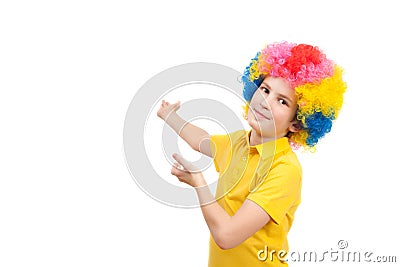 The boy in the bright multi-colored wig Stock Photo