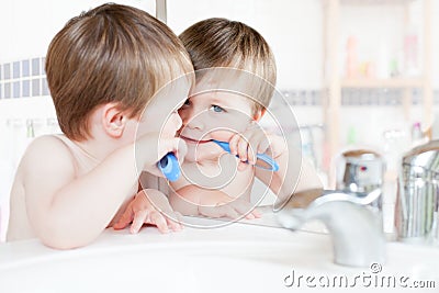 Boy brushing teeth Stock Photo