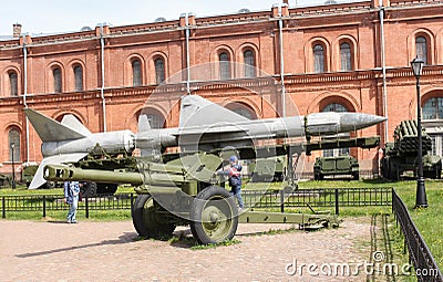 The boy is on the cannon gun. Editorial Stock Photo