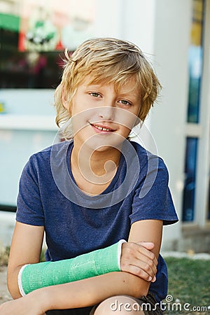 Boy with cast on right hand Stock Photo