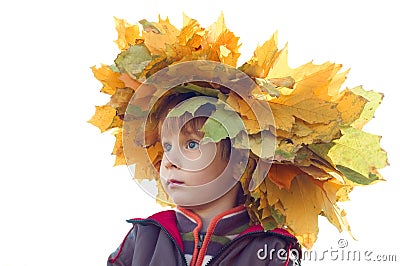 Boy with chaplet of yellow maple leaves Stock Photo