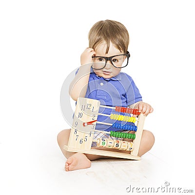 Boy child with abacus clock in glasses counting, smart kid Stock Photo