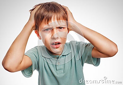 Boy child man upset angry shout produces evil face Stock Photo