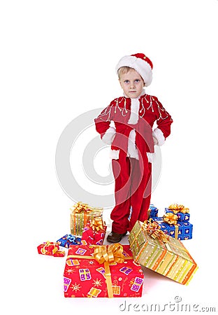 Boy in christmas clothes with toys Stock Photo