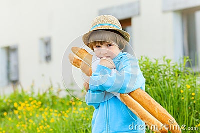 The boy clings to his two breads Stock Photo