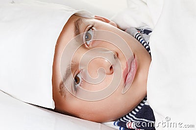 Boy with the compress preparing for treatment procedures Stock Photo