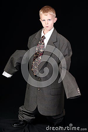 Boy in Dad's Business Suit Stock Photo