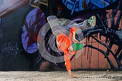 Boy dancing on the street graffity wall Stock Photo