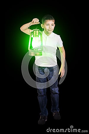 Boy in the darkness with green lantern Stock Photo