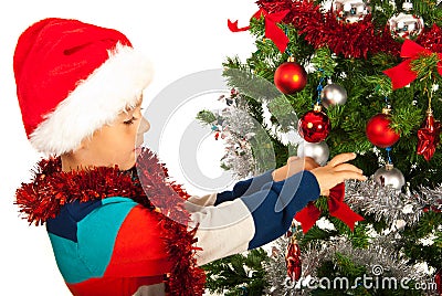 Boy decorate Christmas tree Stock Photo