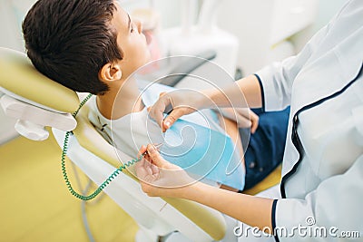 Boy in a dental chair, pediatric dentistry Stock Photo