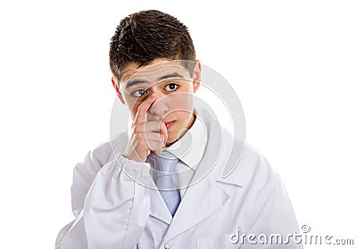 Boy doctor touching his nose Stock Photo