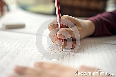 Boy doing his school work or homework Stock Photo