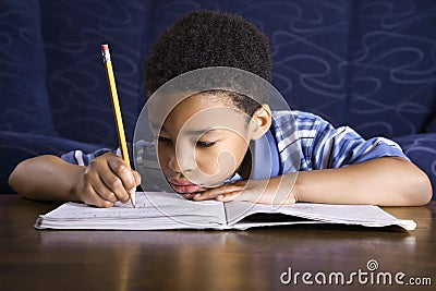 Boy Doing Homework Stock Photo