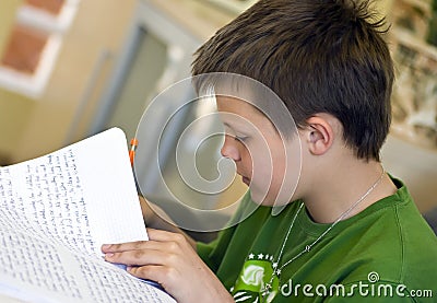 Boy doing homework Stock Photo