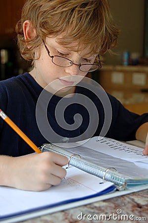 Boy doing homework Stock Photo