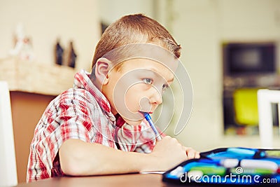 Boy is doing homework Stock Photo