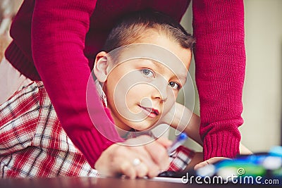 Boy is doing homework Stock Photo