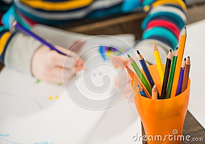 Boy drawing with pencils Stock Photo