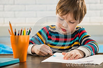 Boy drawing with pencils Stock Photo