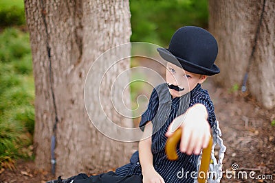 Boy dressed as Charlie Chaplin Stock Photo