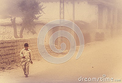 Boy in duststorm Editorial Stock Photo