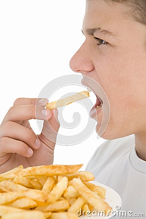 Boy eating French fries Stock Photo