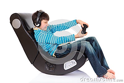 Boy in ergonomic chair Stock Photo