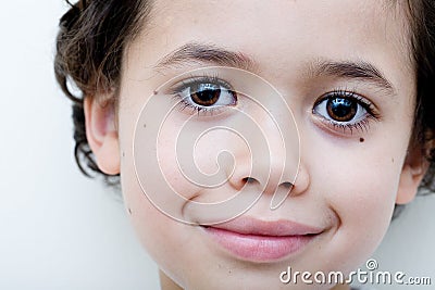 Boy of european and asian parentage smiles. Stock Photo