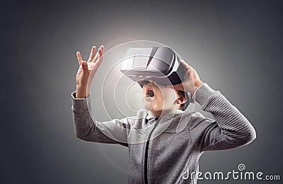 Boy experiencing using a virtual reality headset Stock Photo