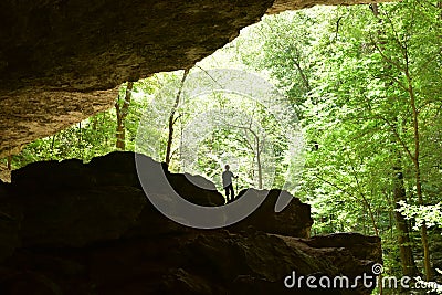 A boy exploring a cave Editorial Stock Photo