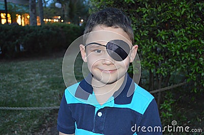 Boy with an eye patch Stock Photo
