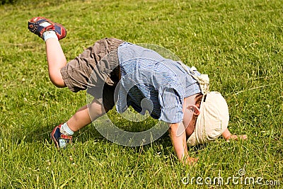 Boy fall down in park Stock Photo